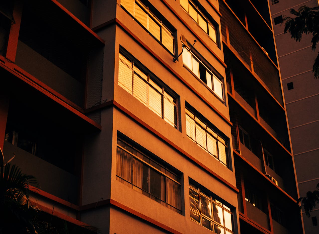 Home Close-up of a residential building facade illuminated by warm sunset light.